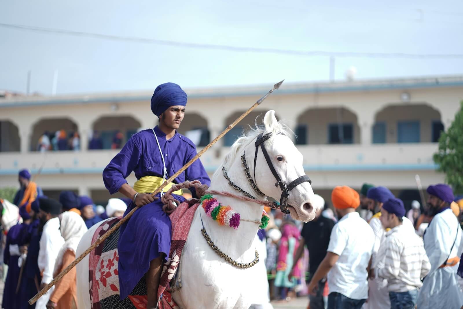 A young man riding a horse during the Hola Mohalla festival in Punjab, India